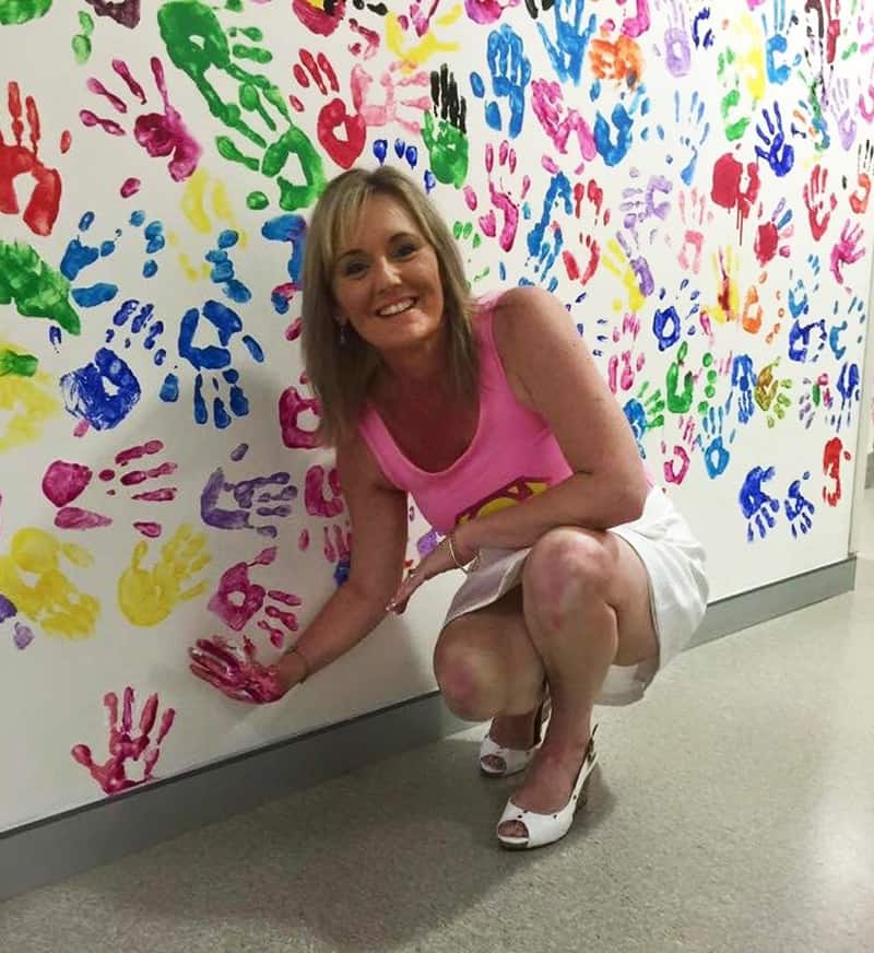 Leanne Weyer after radiation treatment and the patient wall.