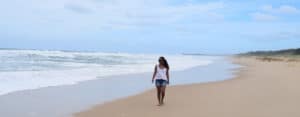 Anet Mathews walking at the beach